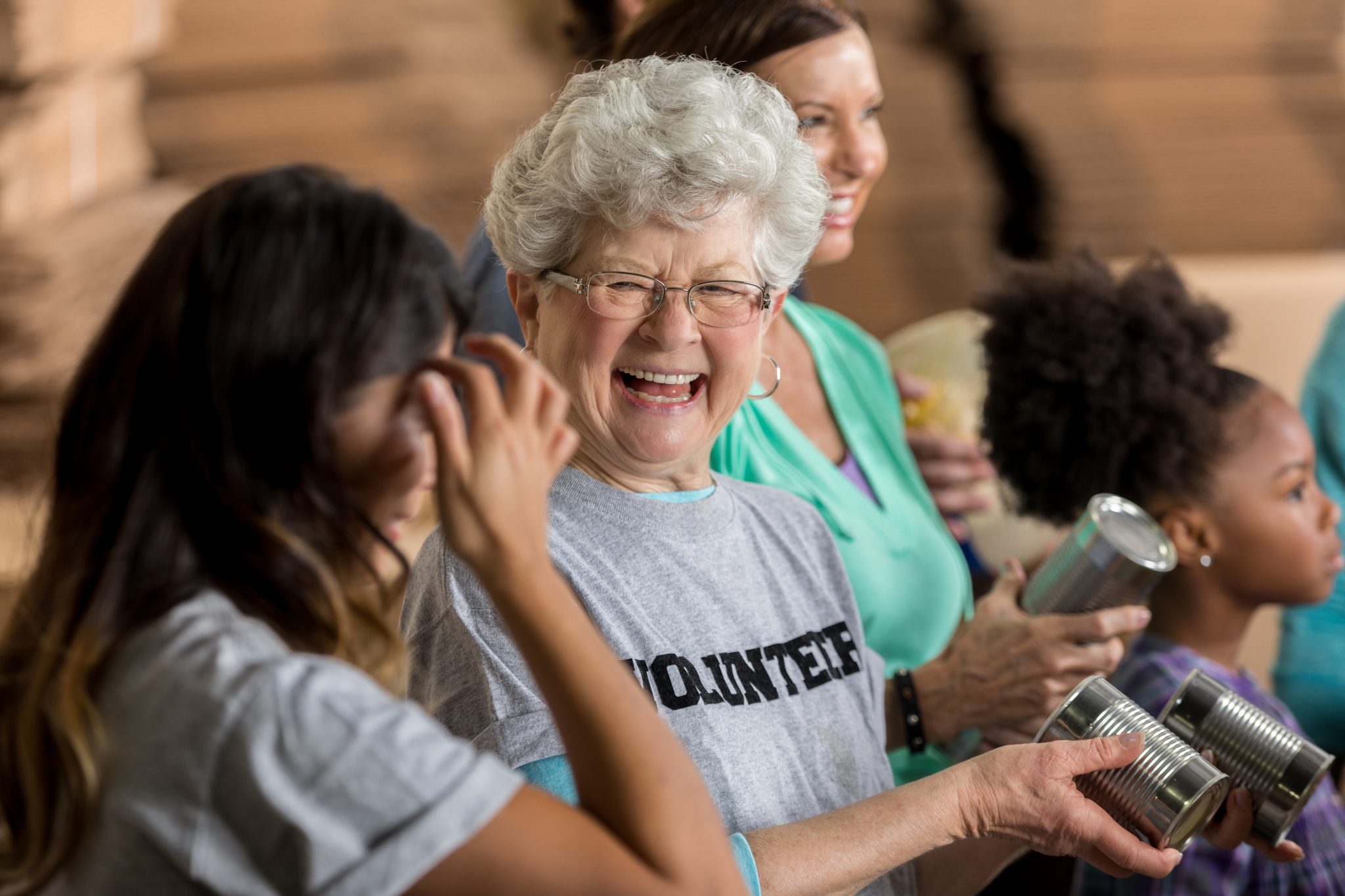 Active senior woman enjoys volunteering at food bank